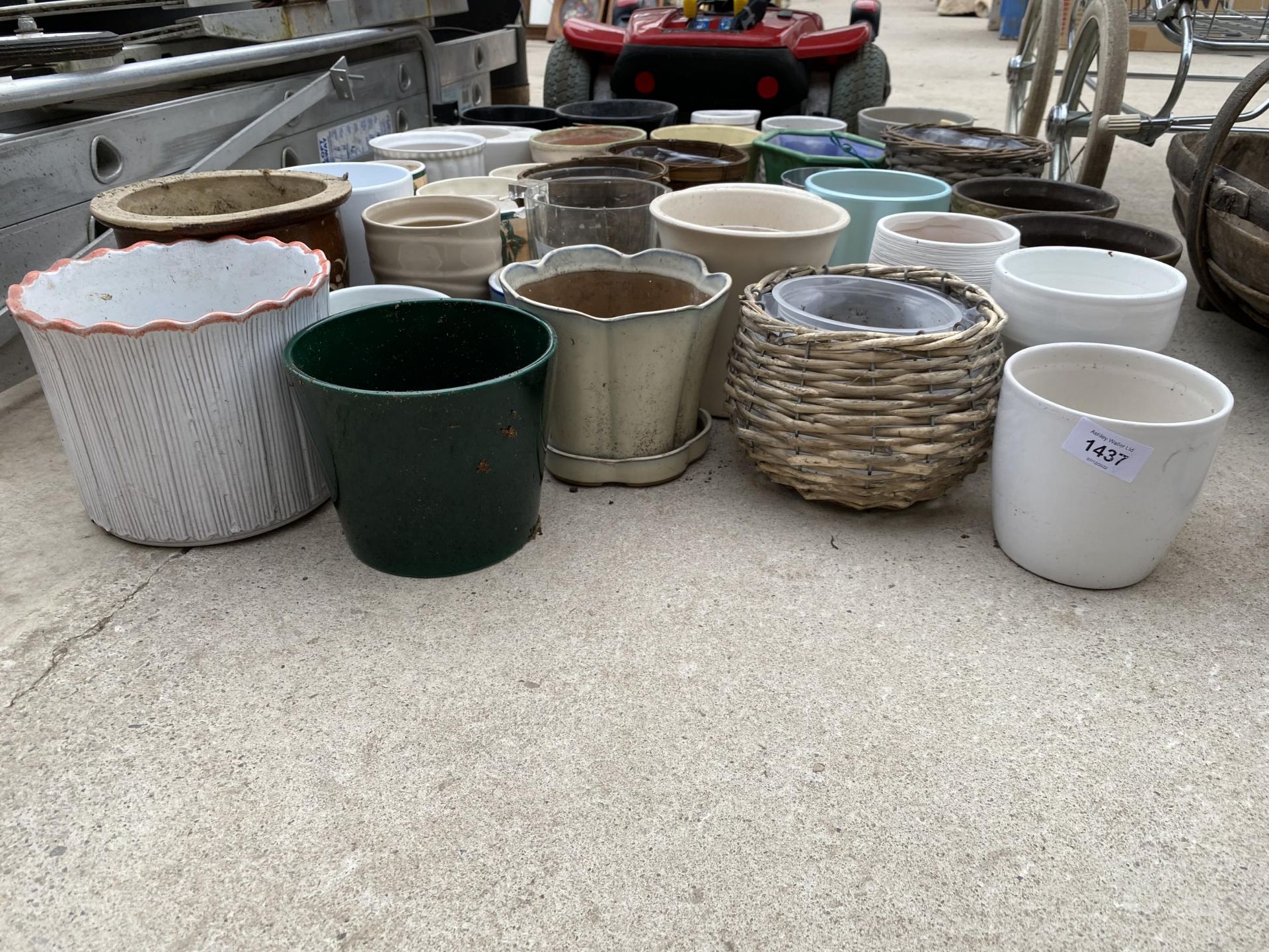 A LARGE QUANTITY OF CERAMIC AND WICKER PLANT POTS - Image 2 of 2