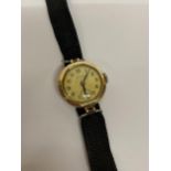 A VINTAGE 9CT YELLOW GOLD CASED ROTARY WATCH
