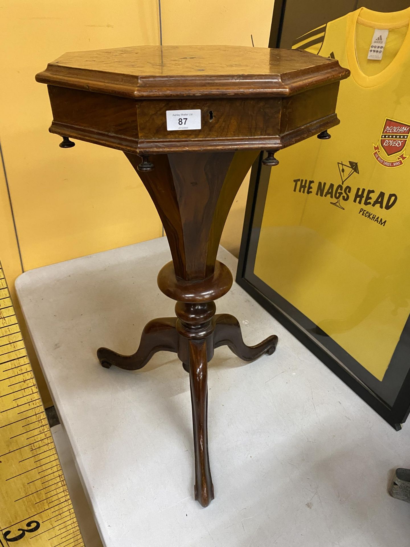 A FLORAL INLAID WALNUT OCTAGONAL SEWING TABLE ON TRIPOD BASE