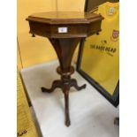 A FLORAL INLAID WALNUT OCTAGONAL SEWING TABLE ON TRIPOD BASE