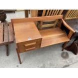 A RETRO TEAK TELEPHONE TABLE/SEAT ENCLOSING TWO DRAWERS, 36" WIDE