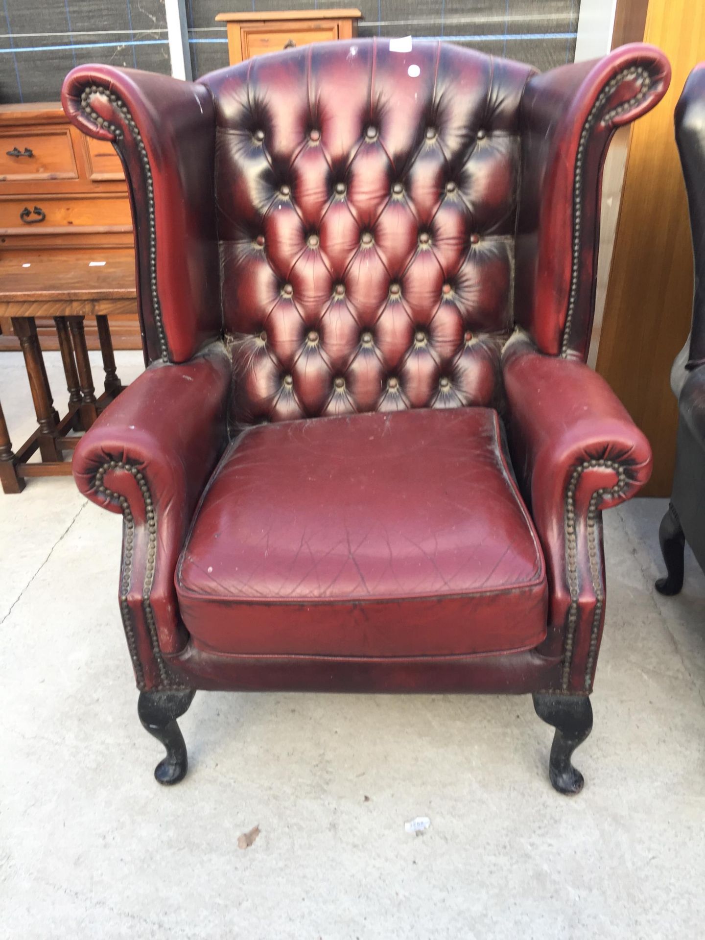 A THOMAS LLOYD OXBLOOD WINGED FIRESIDE CHAIR ON CABRIOLE LEGS - Image 2 of 4