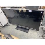 A 32"M PANASONIC TELEVISION WITH REMOTE CONTROL