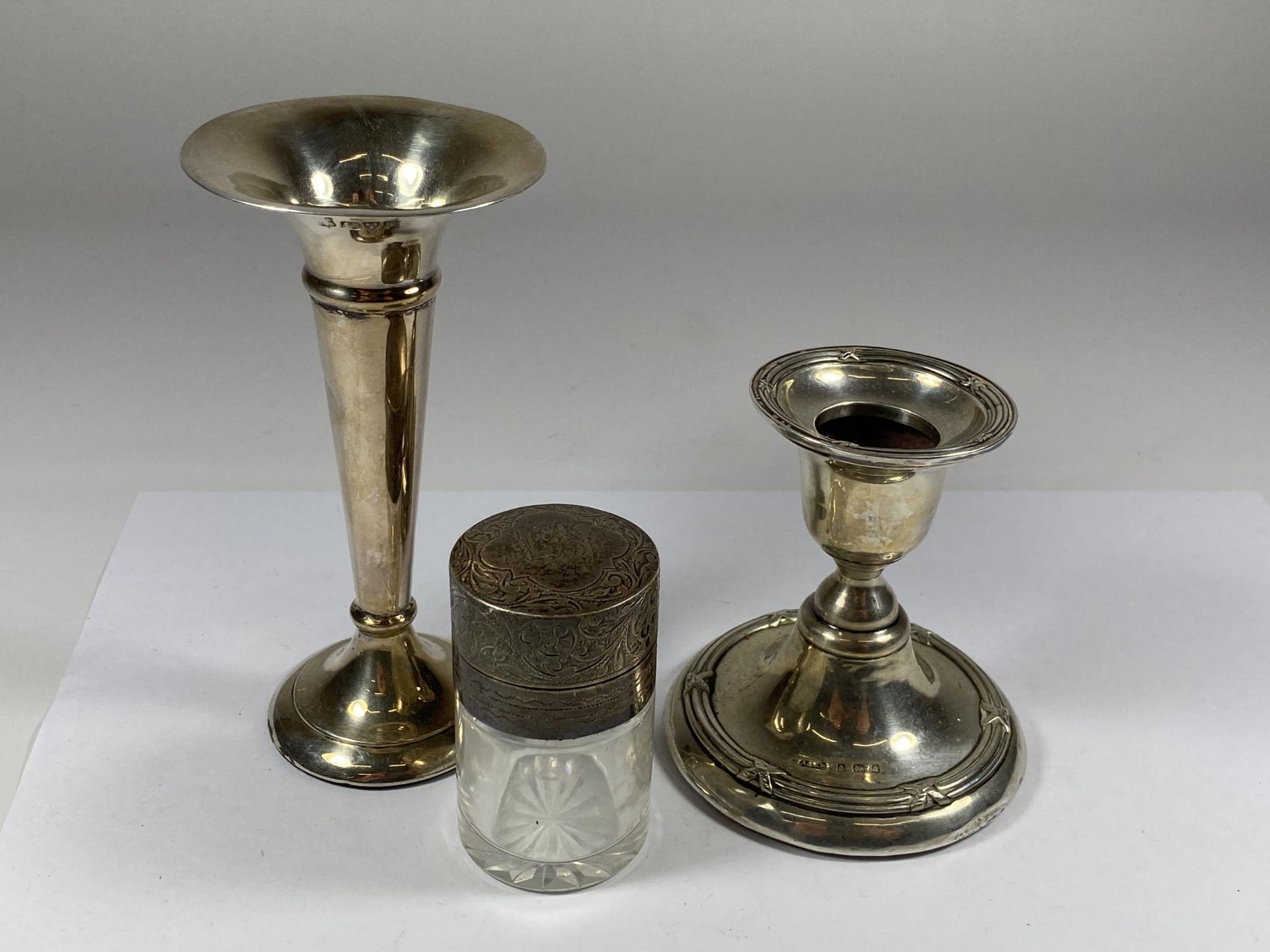 THREE HALLMARKED SILVER ITEMS - POSY VASE, CANDLESTICK AND PERFUME BOTTLE