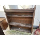 A VICTORIAN FOUR TIER OAK OPEN BOOKCASE WITH GOTHIC DESIGN CORNICE, 54" WIDE