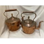 TWO LARGE COPPER KETTLES WITH ACORN FINIALS