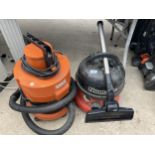 A VAX VACUUM CLEANER AND A HENRY VACUUM CLEANER