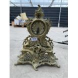 A HEAVY DECORATIVE BRASS FRENCH CLOCK