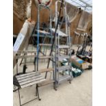 AN ASSORTMENT OF ITEMS TO INCLUDE TWO SETS OF STEPO LADDERS, A FOLDING CHAIR AND A PARASOL BASE ETC