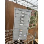 A BISLEY MINITURE TEN DRAWER FILING CABINET (ONE HANDLE MISSING)