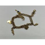 A 9CT YELLOW GOLD CHARM BRACELET AND CHARMS, WEIGHT 13.1G, BOXED