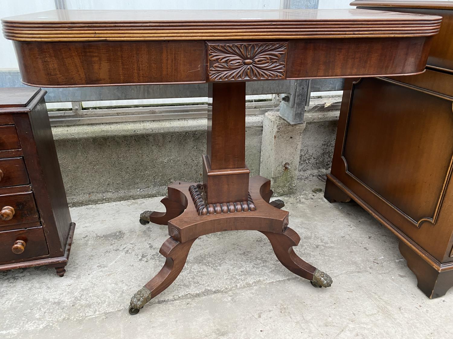 A 19TH CENTURY MAHOGANY FOLD-OVER CARD TABLE ON QUATREFOIL BASE WITH BRASS LION PAW FEET, 35" WIDE - Image 2 of 7