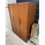 A RETRO TEAK THREE DOOR WARDROBE, TWO BEING BI-FOLD, 48" WIDE