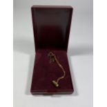 A 9CT GOLD BOXED TIE PIN