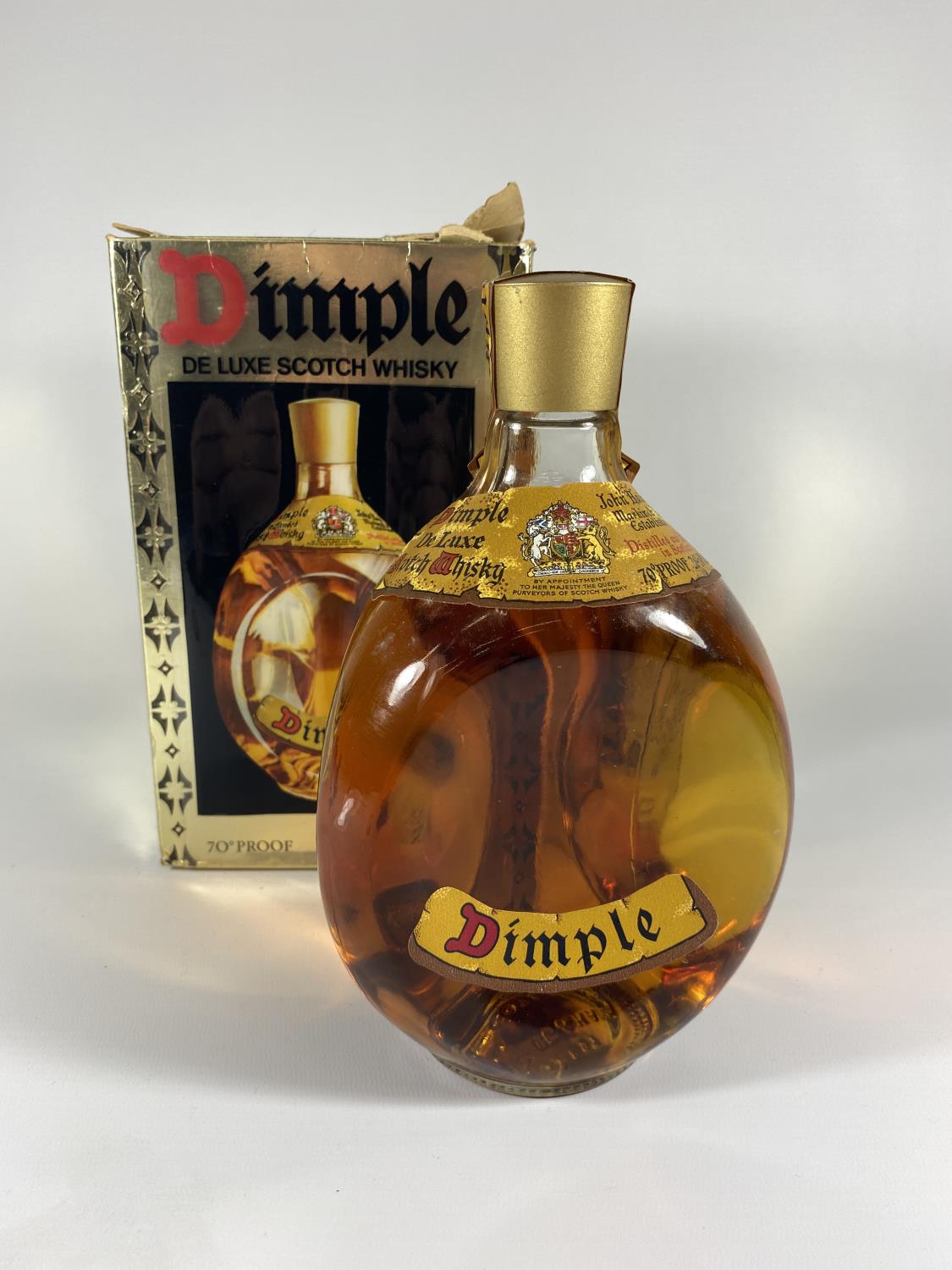 A BOXED DIMPLE DE LUXE SCOTCH WHISKY 70 PROOF 26 2/3 FL.OZS. PROCEEDS TO BE DONATED TO EAST CHESHIRE