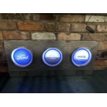 A FORD RS2000 ILLUMINATED LIGHT BOX SIGN WITH THREE IMAGES IN SEPERATE HEADLIGHT DESIGN- WORKING