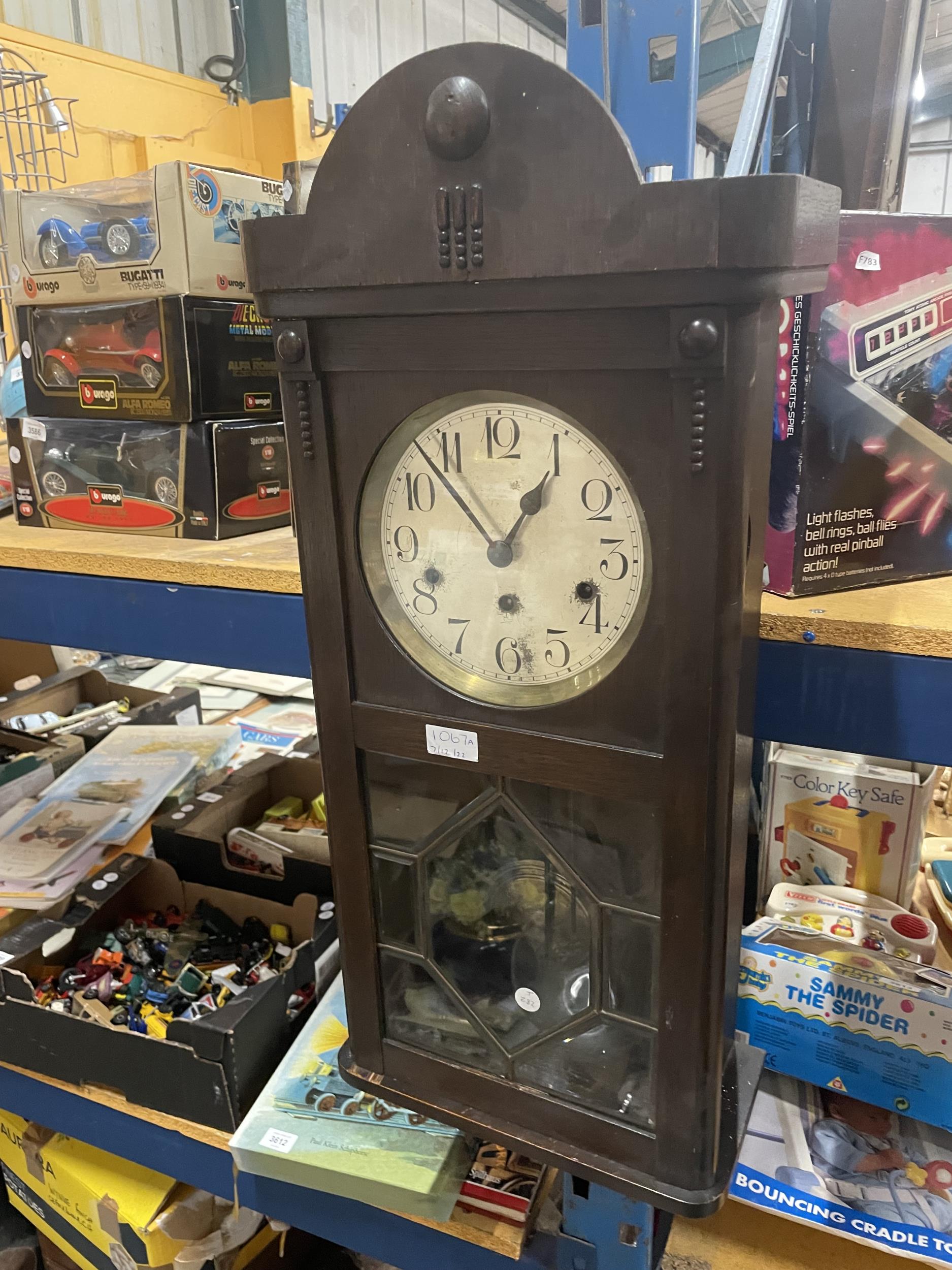 A 1920's OAK CASED WESTMINSTER CHIMING WALL CLOCK