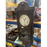 A 1920's OAK CASED WESTMINSTER CHIMING WALL CLOCK