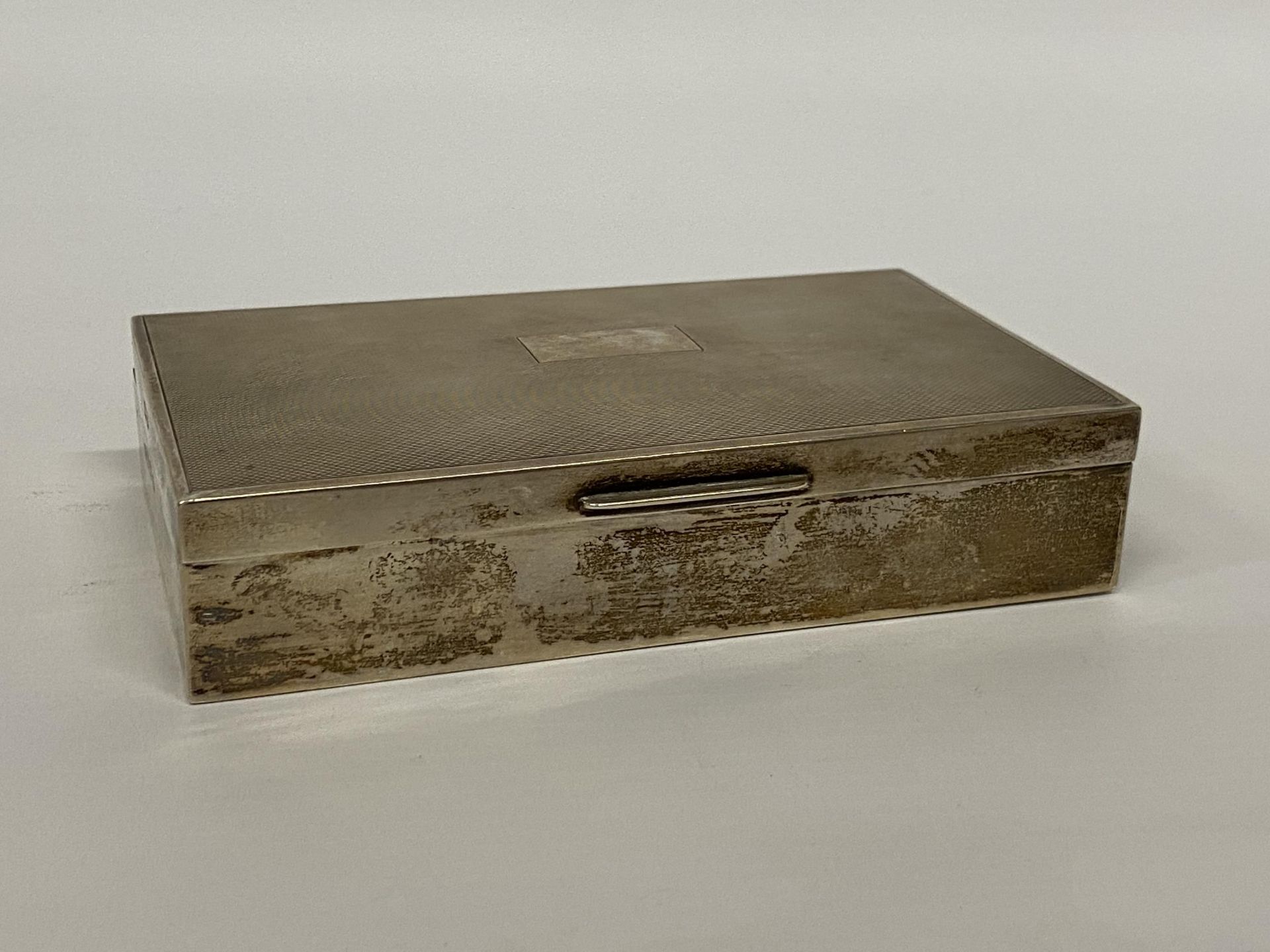 A BIRMINGHAM HALLMARKED SILVER CIGARETTE BOX, MAKER E & N S