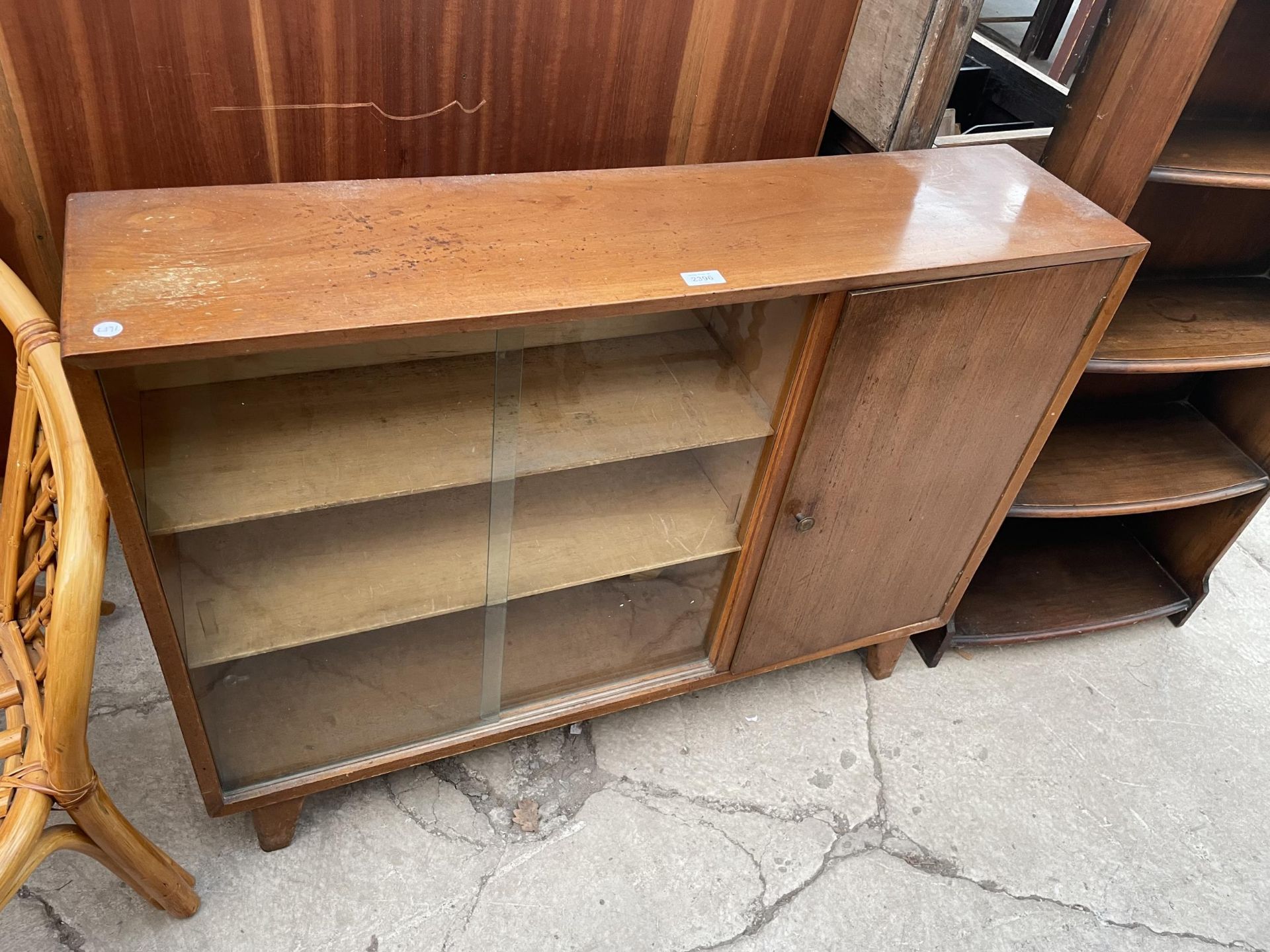 A MID 20TH CENTURY 'LEBUS' CABINET WITH TWO SLIDING GLASS DOORS, 42" WIDE