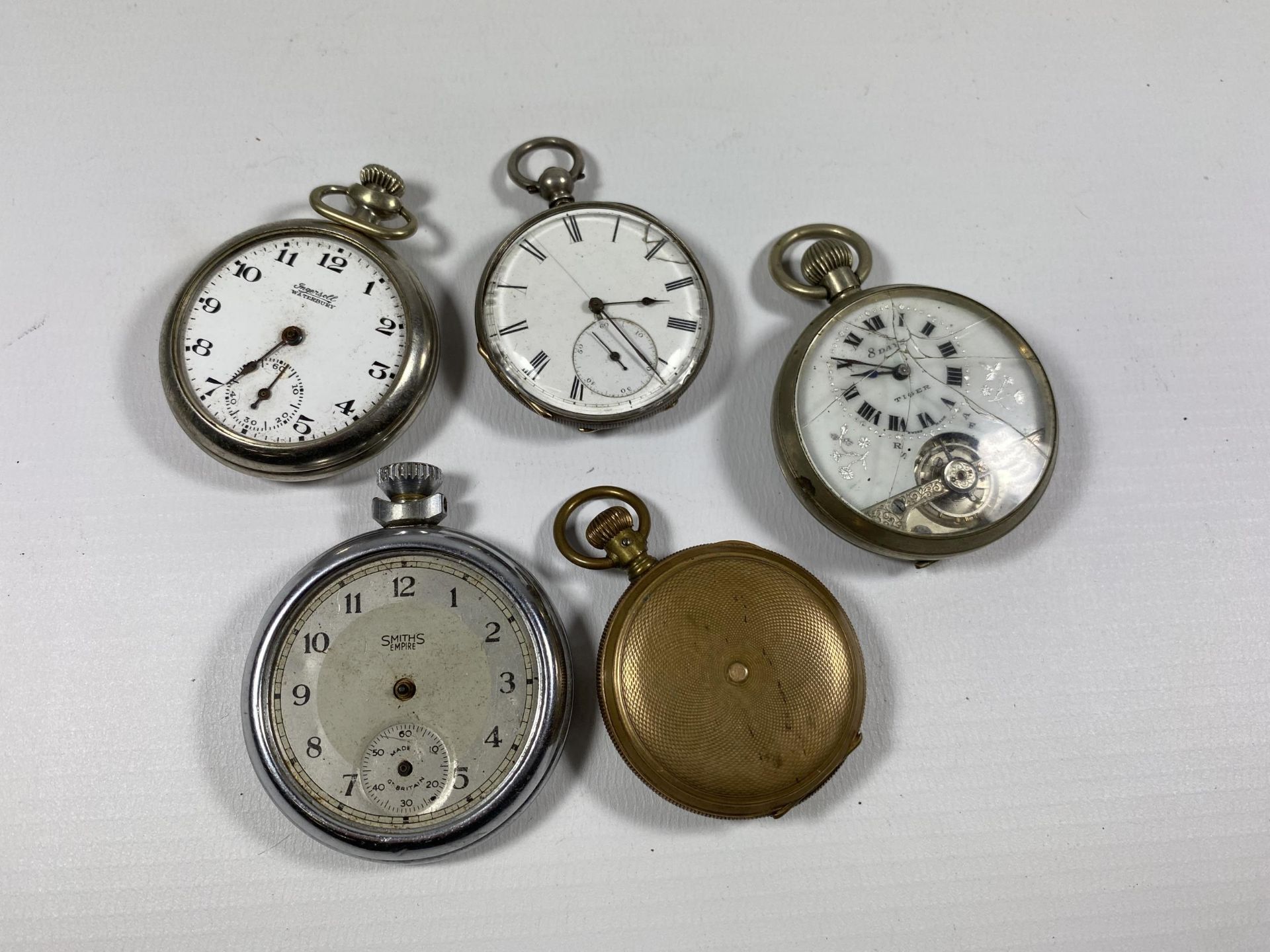 A GROUP OF FIVE POCKET WATCHES TO INCLUDE A TIGER 8 DAY EXAMPLE ETC