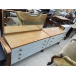 A 1970'S OAK AND PAINTED DRESSING CHEST AND MATCHINE CHEST OF DRAWERS