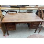 AN OAK 'ABBESS' STYLE TWIN PEDESTAL DESK WITH FIVE DRAWERS, 54X29"