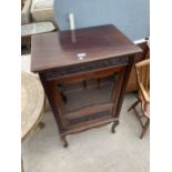 A VICTORIAN MAHOGANY MUSIC CABINET WITH GLASS DOOR, FOLIATE CARVING ON CABRIOLE LEGS, 22" WIDE