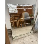 AN IKEA 'NESSANE' WALL MIRROR WITH FOLIATE DECORATION, 30X22"