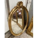 A MODERN OVAL GILT FRAMED WALL MIRROR, 24X16"