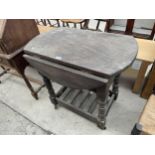 A DARK ELM 20TH CENTURY DROP-LEAF TABLE/TROLLEY ON TURNED LEGS, 30" DIAMETER OPENED