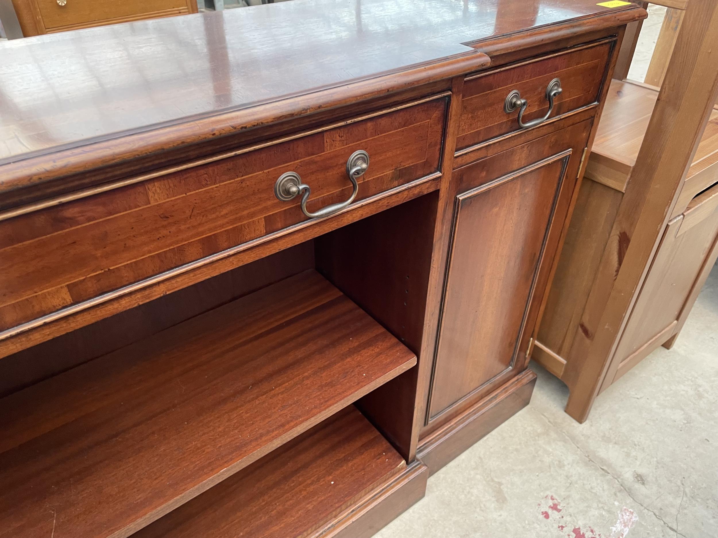 A REPRODUCTION MAHOGANY AND CROSSBANDED BREAKFRONT BOOKCASE WITH TWO CUPBOARDS AND THREE DRAWERS, - Image 4 of 4