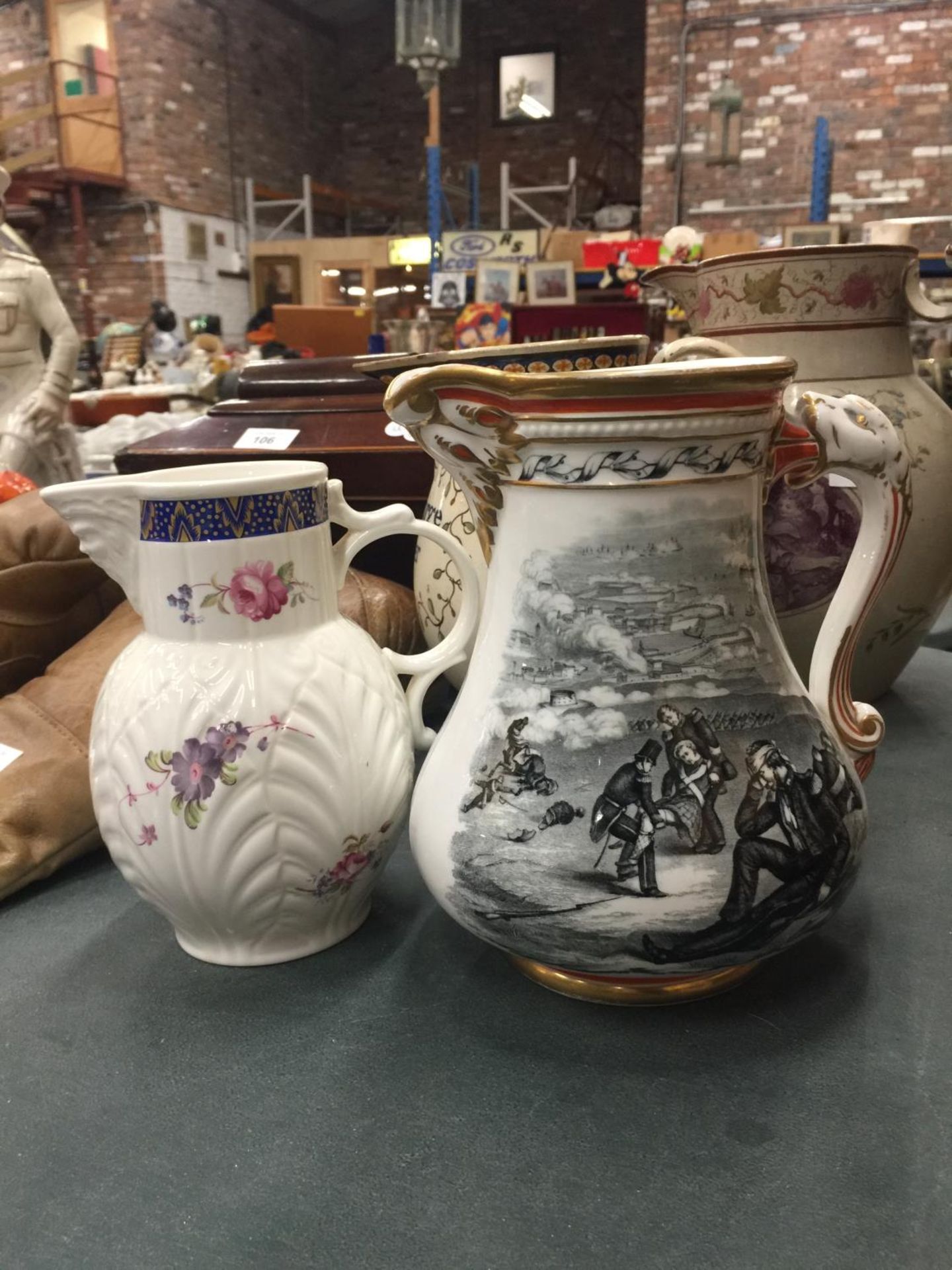 TWO VINTAGE JUGS, ONE TRANSFER PATTERNED 'THE OLD PATRIOTIC JUG' PLUS A COPY OT 'THE CAUGHLEY MASK-