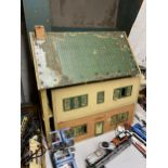 A LARGE VINTAGE WOODEN DOLLS HOUSE