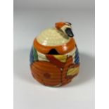 A CLARICE CLIFF CERAMIC HONEY POT IN THE 'FANTASQUE' PATTERN (CHIP TO RIM)