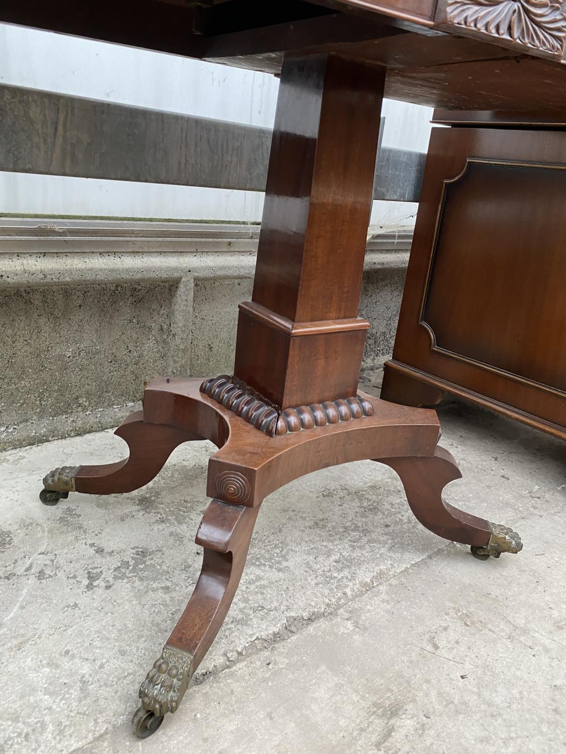 A 19TH CENTURY MAHOGANY FOLD-OVER CARD TABLE ON QUATREFOIL BASE WITH BRASS LION PAW FEET, 35" WIDE - Image 5 of 7