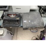 A VINTAGE OLIVER TYPEWRITER WITH CARRY CASE