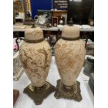 A PAIR OF VICTORIAN GLASS LIDDED POTS ON BRASS BASES HEIGHT 43CM - ONE A/F