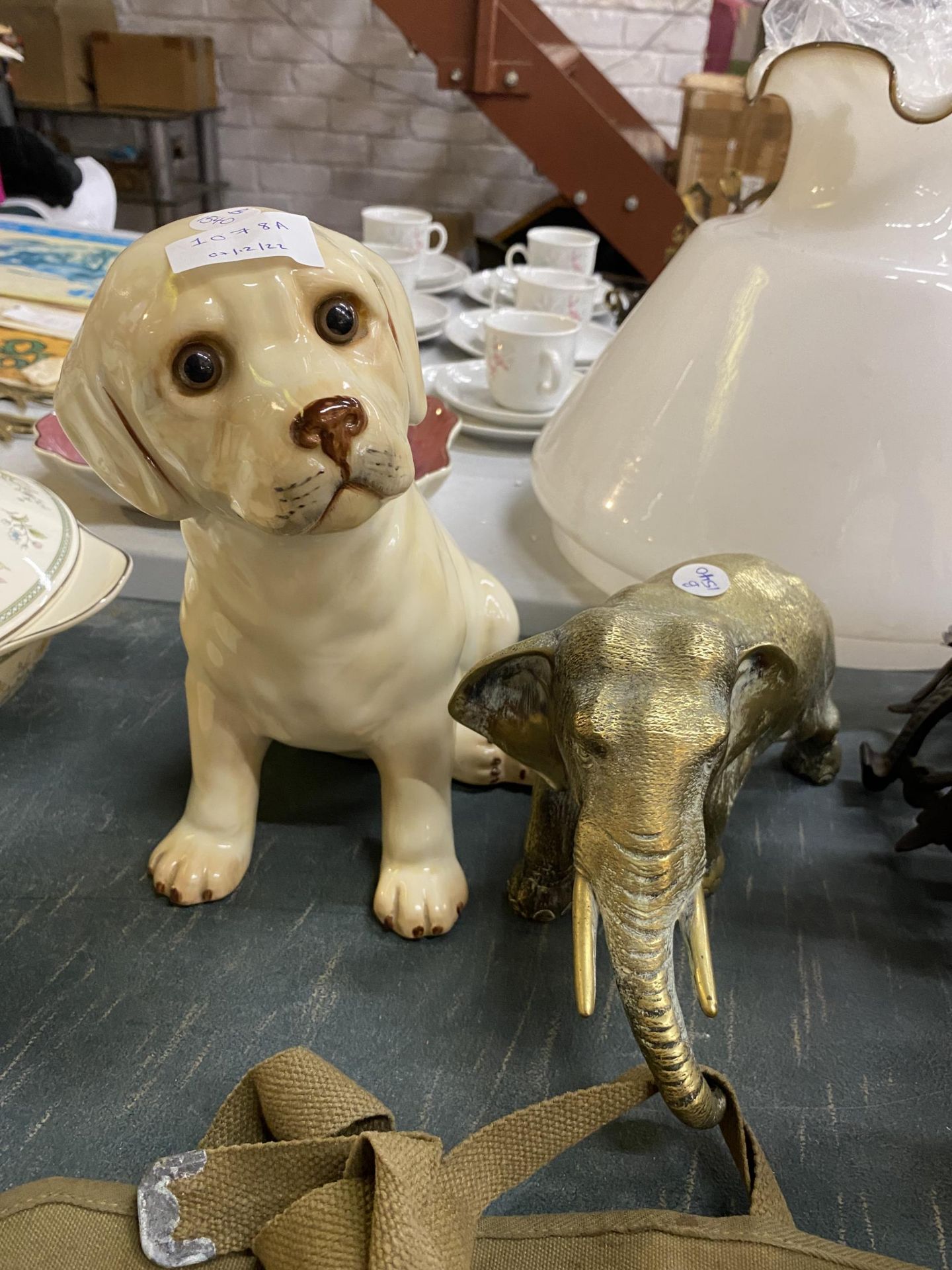 TWO ITEMS - A VINTAGE BRASS ELEPHANT & CATS & CO CERAMIC DOG FIGURE