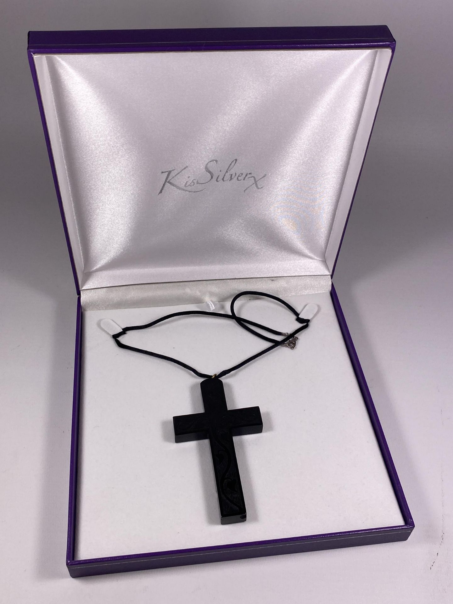 A BOXED WHITBY JET STYLE CROSS NECKLACE