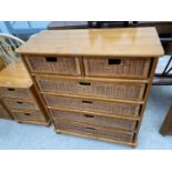 A MODERN PINE CHEST OF TWO SHORT AND FOUR LONG WICKER DRAWERS, 35" WIDE
