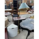 A MODERN BRASS READING LAMP AND LLOYD LOOM LINEN BASKET