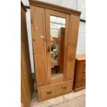 AN EARLY 20TH CENTURY PINE MIRROR-DOOR WARDROBE, 35" WIDE