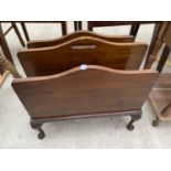 A MID 20TH CENTURY MAHOGANY TWO DIVISION MAGAZINE RACK ON CABRIOLE LEGS