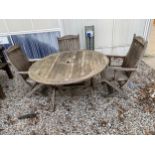 A ROUND TEAK GARDEN TABLE AND THREE FOLDING CHAIRS