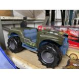 A GREEN PLASTIC TOY ARMY TRUCK