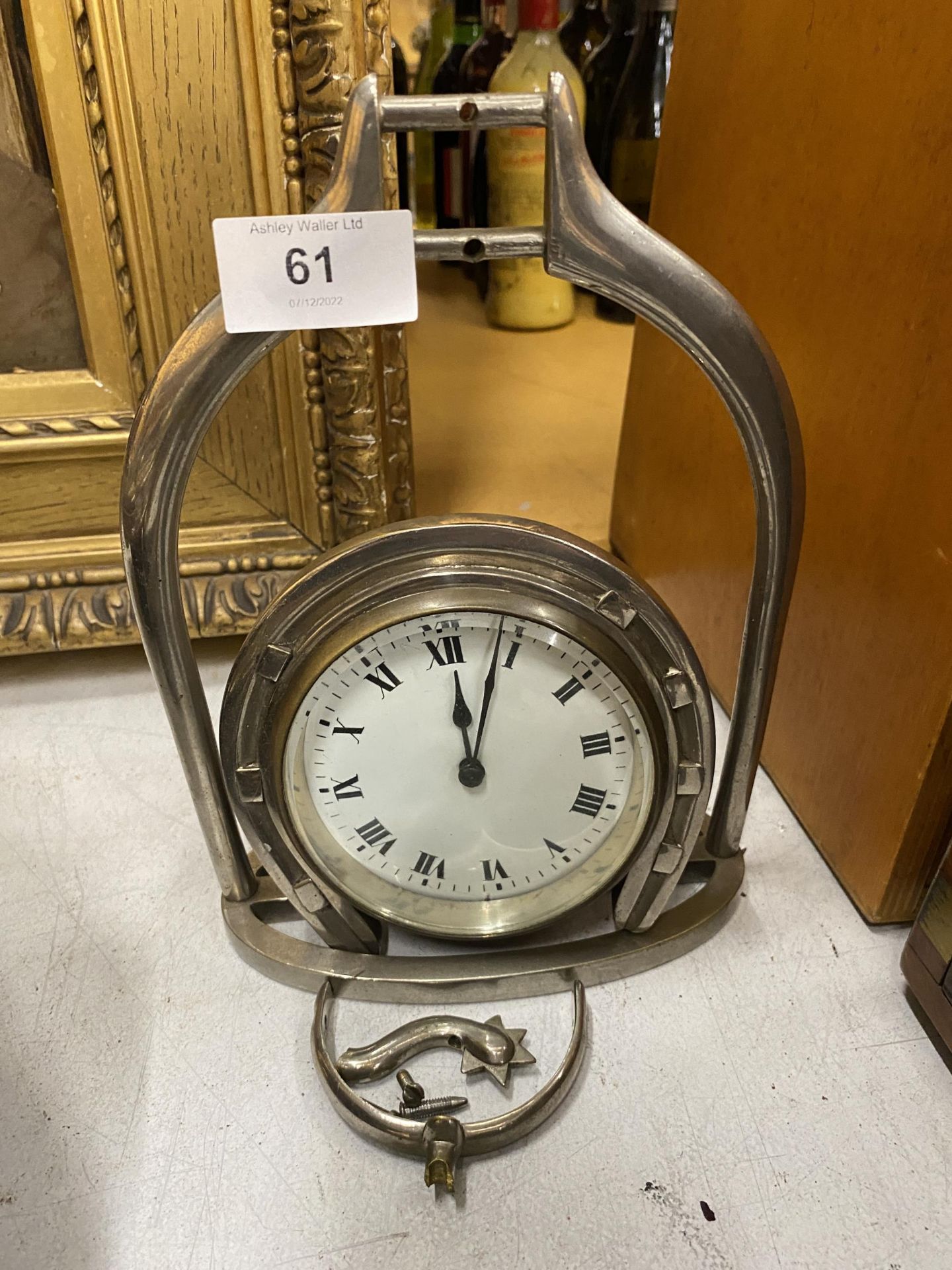 A STAINLESS STEEL HORSE INTEREST HORSESHOE CLOCK