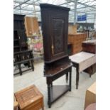 A VICTORIAN OAK CORNER CUPBOARD WITH CARVED UPPER PORTION, ON OPEN BASE, WITH BOBBIN TURNED LEGS,