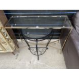 A MODERN METAL FRAMED CONSOLE TABLE WITH GLASS TOP AND WROUGHT IRON HALL TABLE