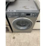 A GREY HOTPOINT 7KG WASHING MACHINE BELIEVED IN WORKING ORDER BUT NO WARRANTY